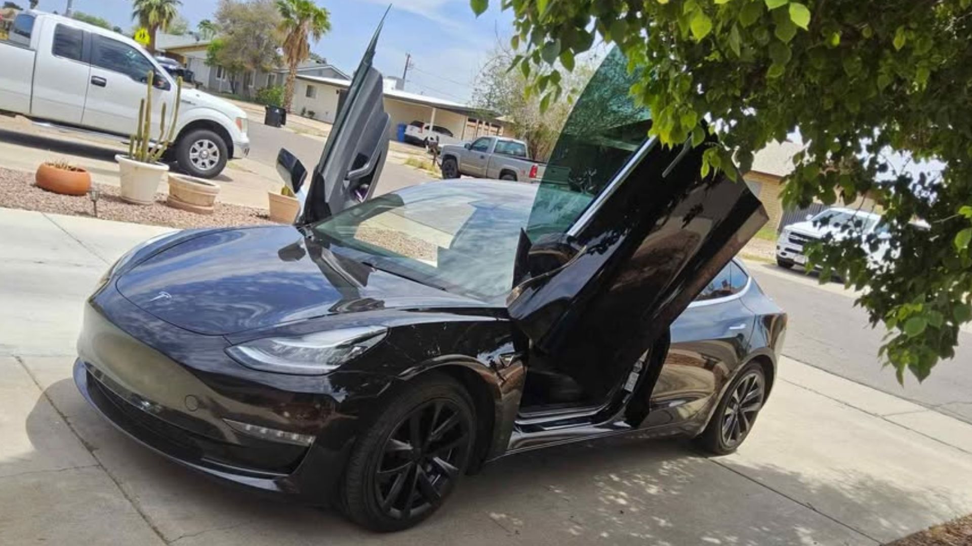 Tesla Model 3 With Scissor Doors Rolls Hard