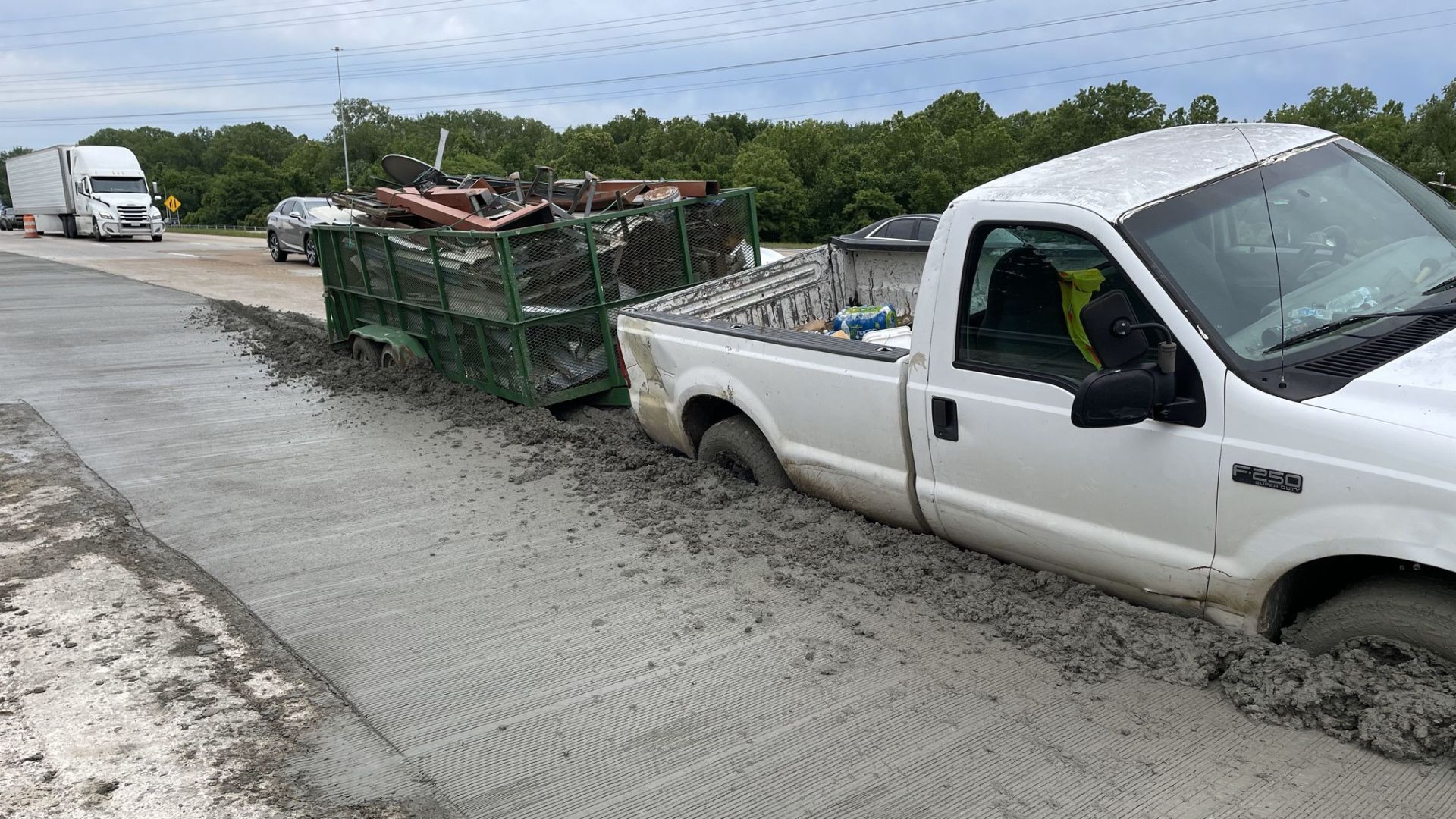Truck Towing Trailer Drives Through Wet Cement On Tennessee Road