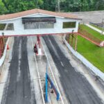 Aerial view of a drag strip facility being converted into a motorsports country club
