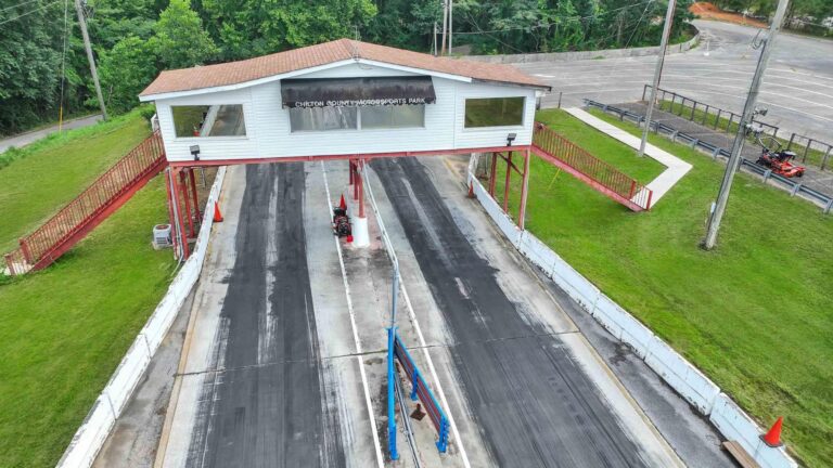 Aerial view of a drag strip facility being converted into a motorsports country club
