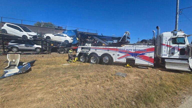 Train colliding with a car-hauling semi-truck on railroad tracks in Texas