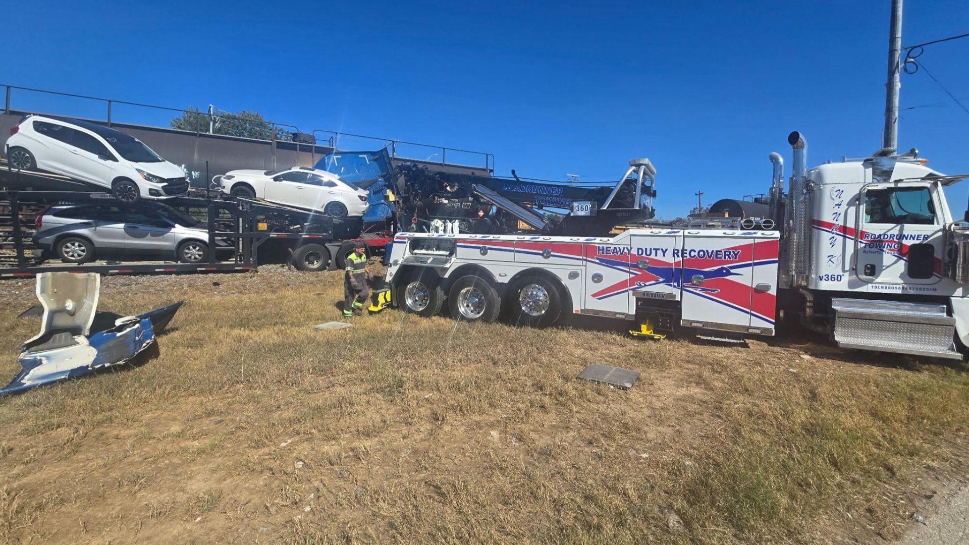 Train colliding with a car-hauling semi-truck on railroad tracks in Texas