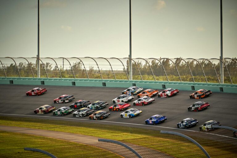 nascar cars racing on a track