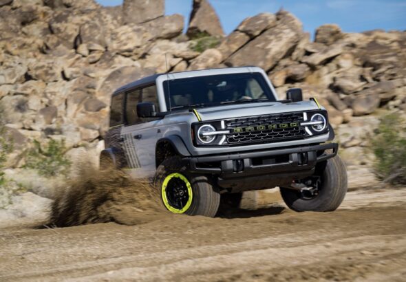 Ford Bronco off-roading on rocky terrain, representing the Bronco SUV platform a rumored pickup variant would share