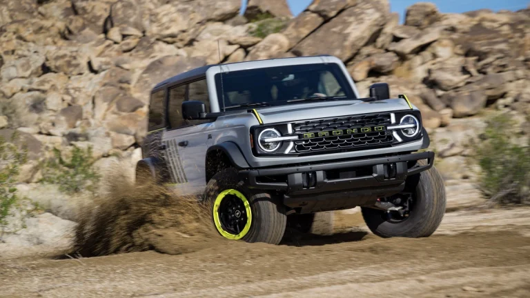 Ford Bronco off-roading on rocky terrain, representing the Bronco SUV platform a rumored pickup variant would share