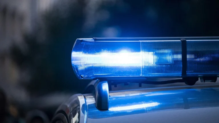 a close up of a police car with its lights on