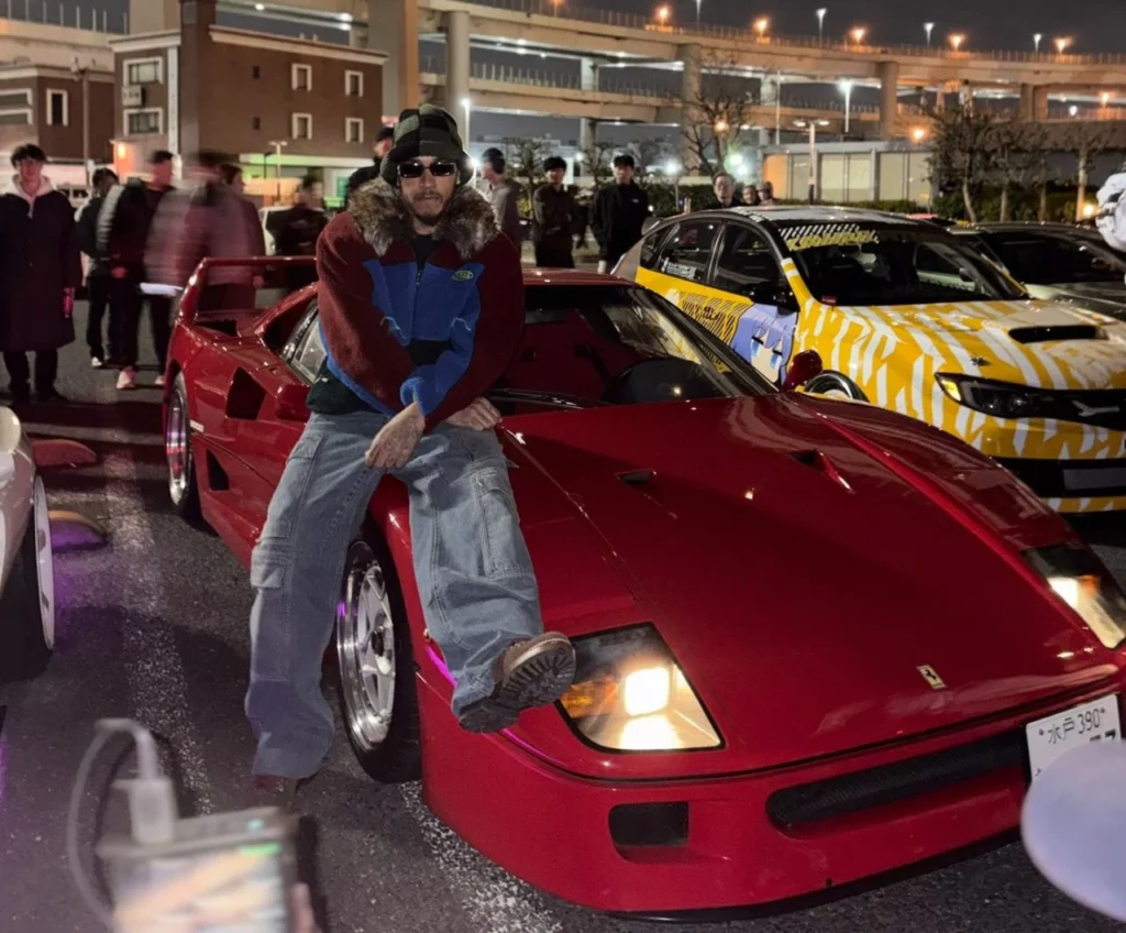Lewis Hamilton with his red Ferrari F40 at a car meet in Tokyo, Japan