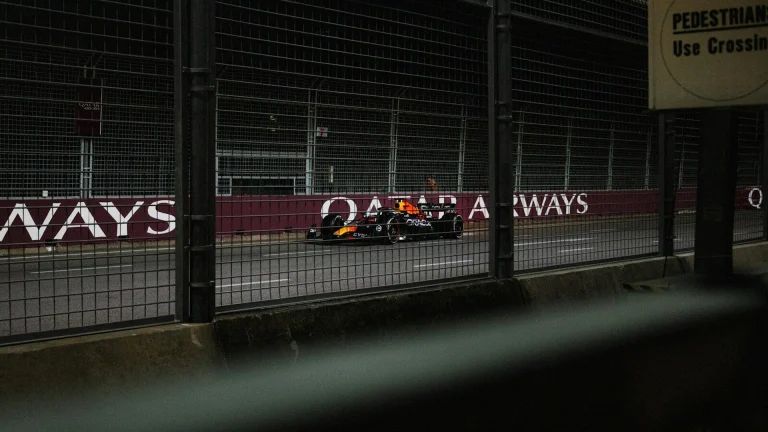 A race car is driving on the track.