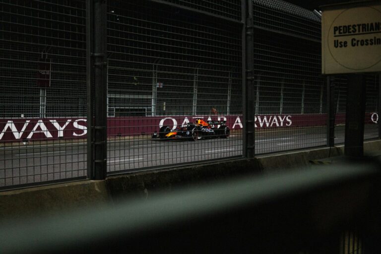 A race car is driving on the track.