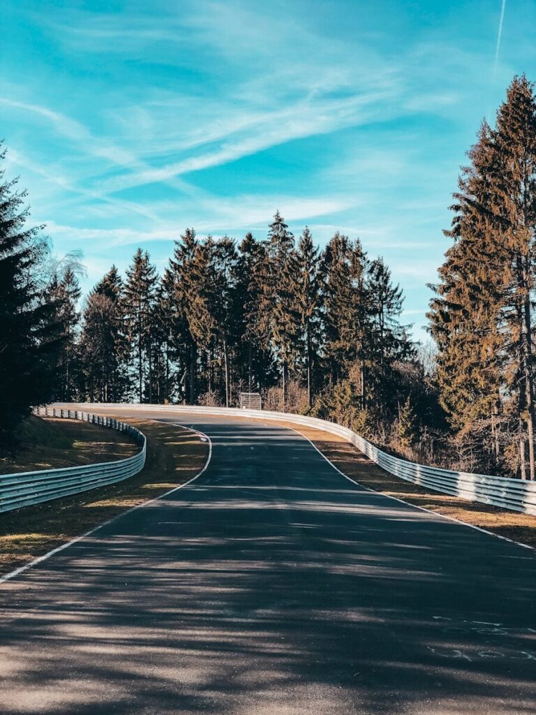 empty roadway under blue sky