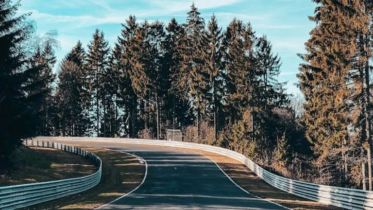 empty roadway under blue sky