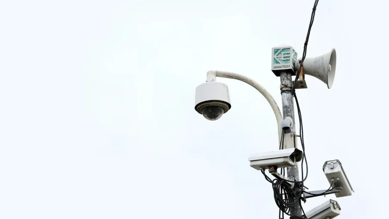 a security camera attached to a street light
