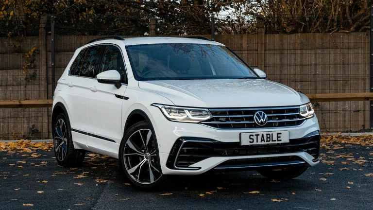 a white car parked in a driveway