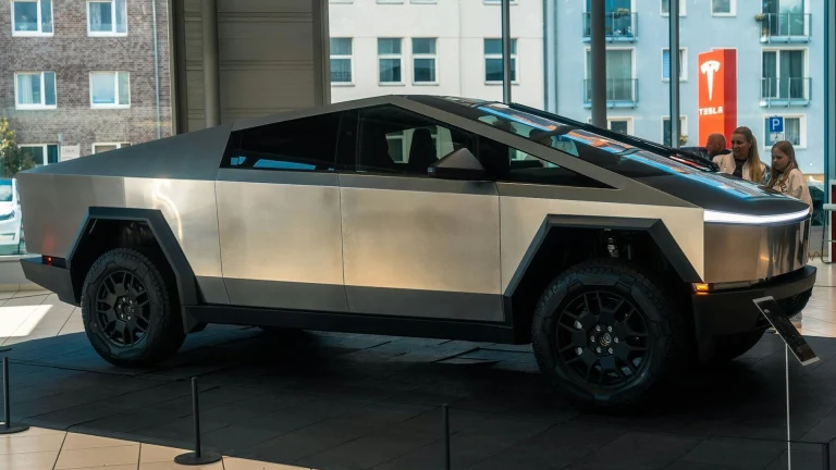 A futuristic car is on display in a building