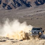 black suv on brown sand during daytime