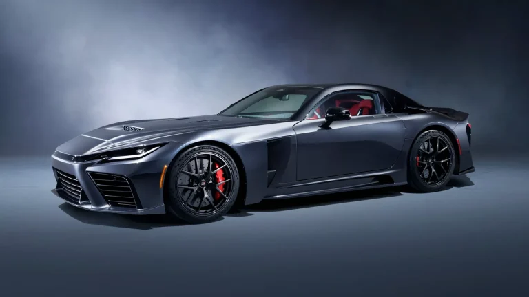 Toyota GR GT prototype parked in a studio setting, showcasing its low, wide flagship sports car design