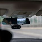 car side mirror with water droplets