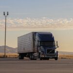 black truck on road during daytime