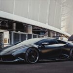 sports car in front of stadium