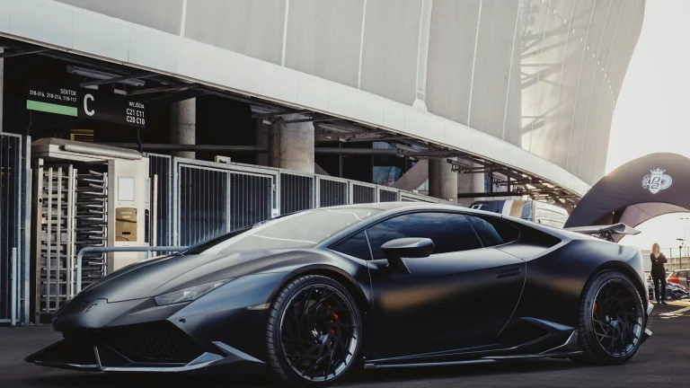 sports car in front of stadium
