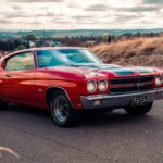 red chevrolet camaro on road during daytime