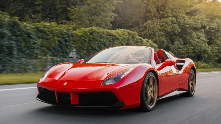 Red Ferrari supercar - Ferrari keeps gas engines and rejects self-driving tech