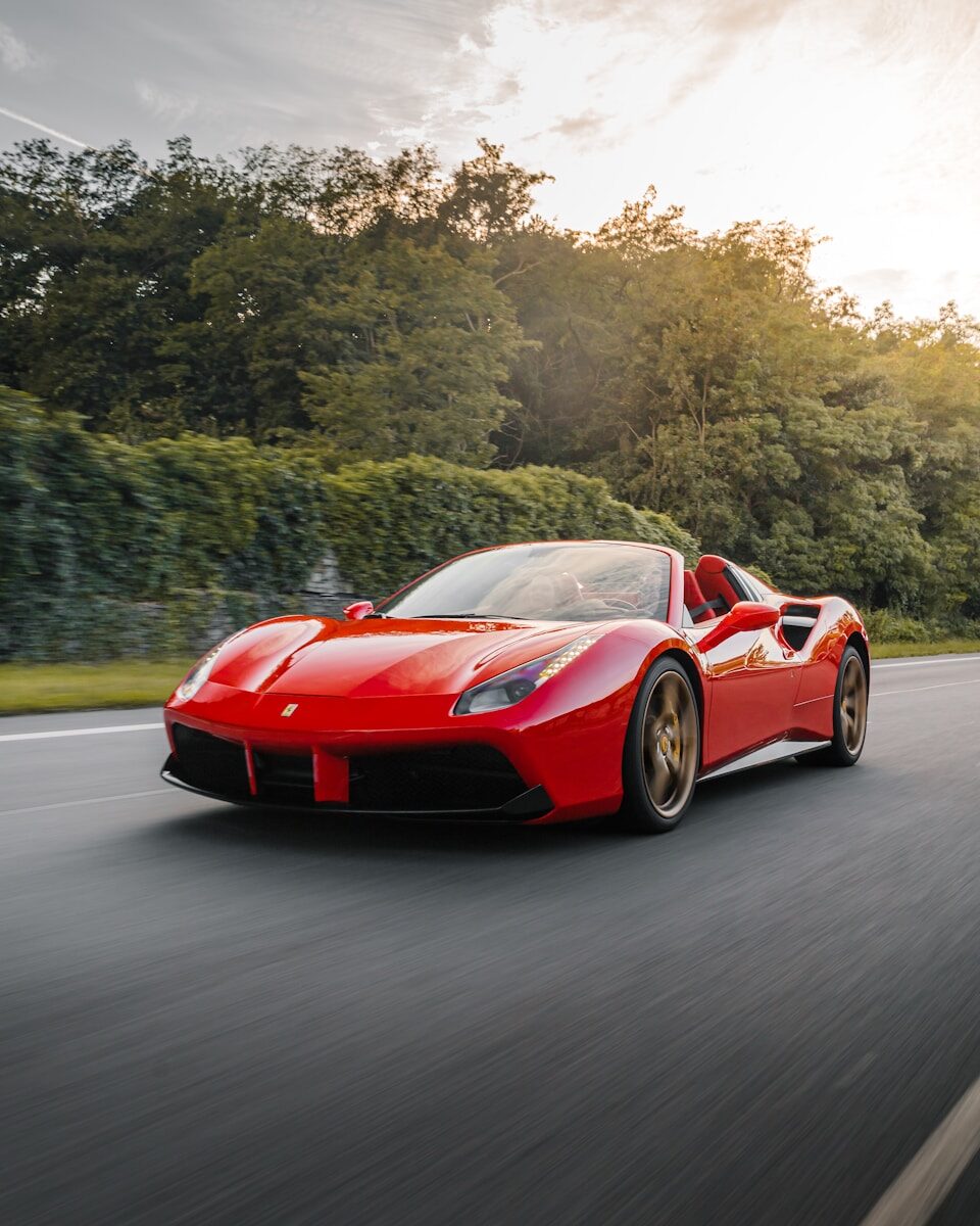 Red Ferrari supercar - Ferrari keeps gas engines and rejects self-driving tech