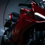 red and black sports bike