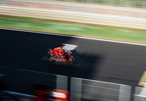 a person riding a motorcycle on a race track