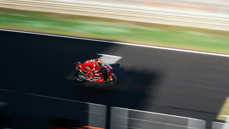 a person riding a motorcycle on a race track