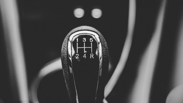 focus photography of car shift gear