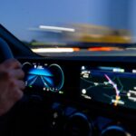 person's hand on steering wheel
