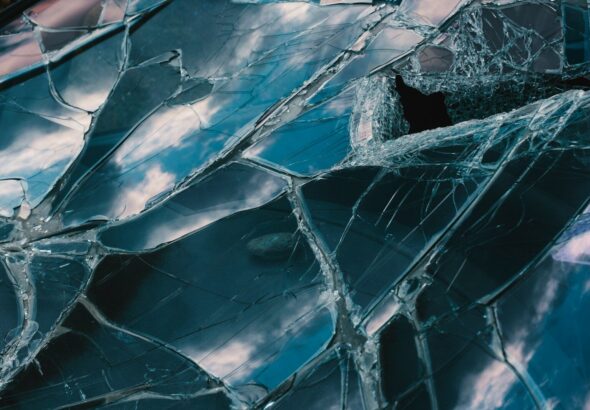 a close up of a broken glass window