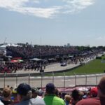 people watching football game during daytime