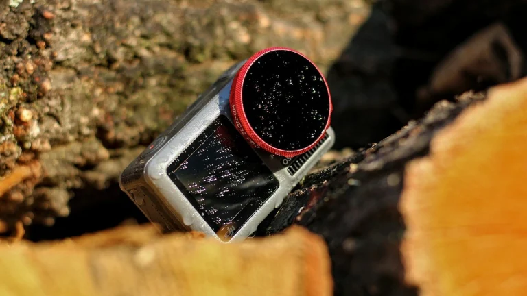 black and red plastic bottle on brown wooden plank