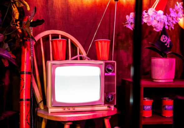 A television set sitting on top of a wooden stand