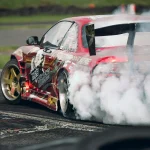 red and white ferrari f 1 on track
