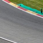 a person riding a motorcycle on a race track