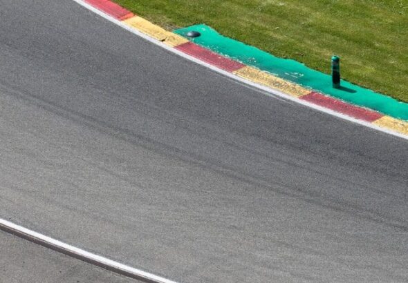 a person riding a motorcycle on a race track