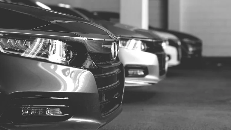 grayscale photo of car on road