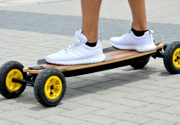 person in white nike sneakers