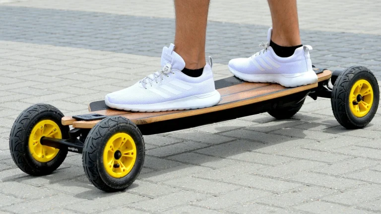 person in white nike sneakers
