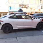A waymo self-driving car is seen in the city.
