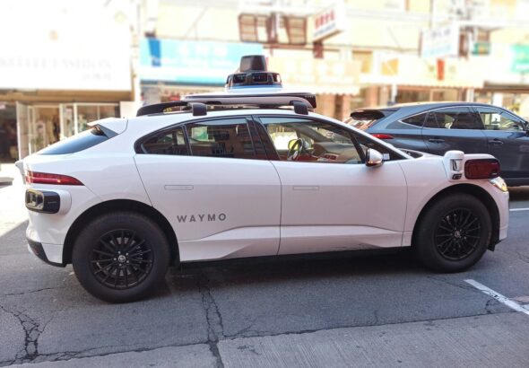 A waymo self-driving car is seen in the city.