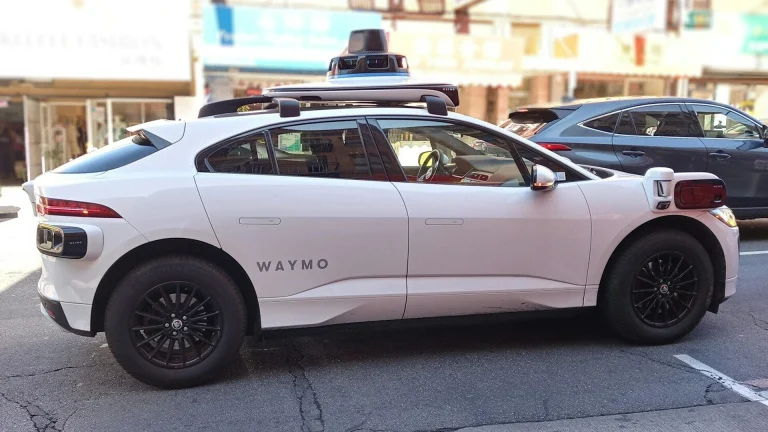 A waymo self-driving car is seen in the city.