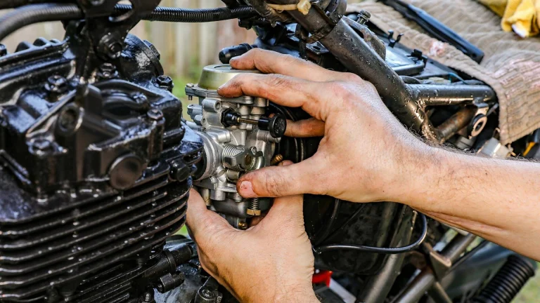 a person holding a car engine