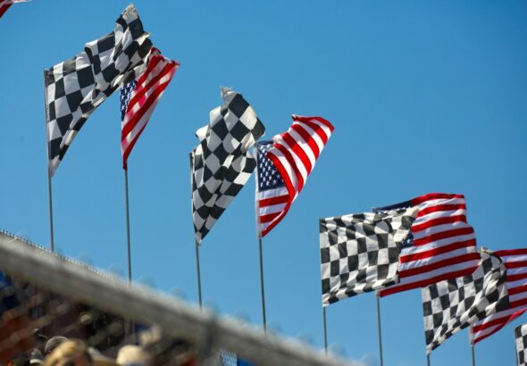 a row of checkered flags blowing in the wind