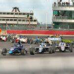 a group of race cars on a track