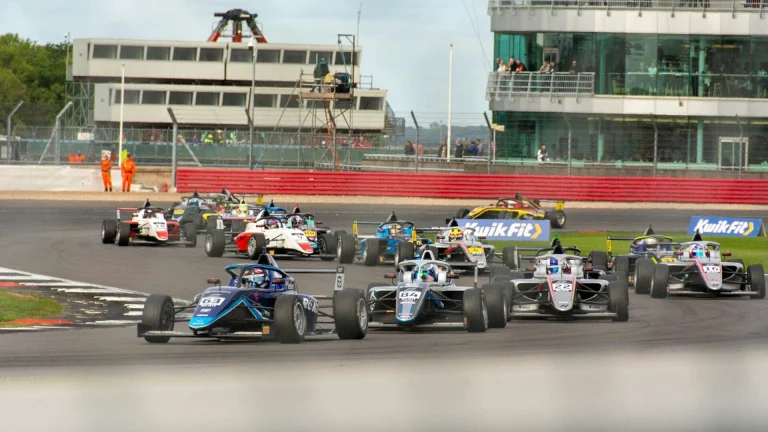 a group of race cars on a track