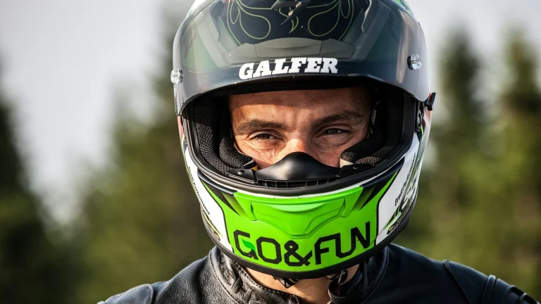 man wearing black multicolored helmet